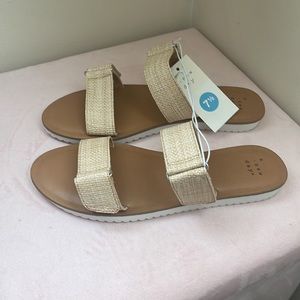 A New day. Tan wicker style double strap sandals